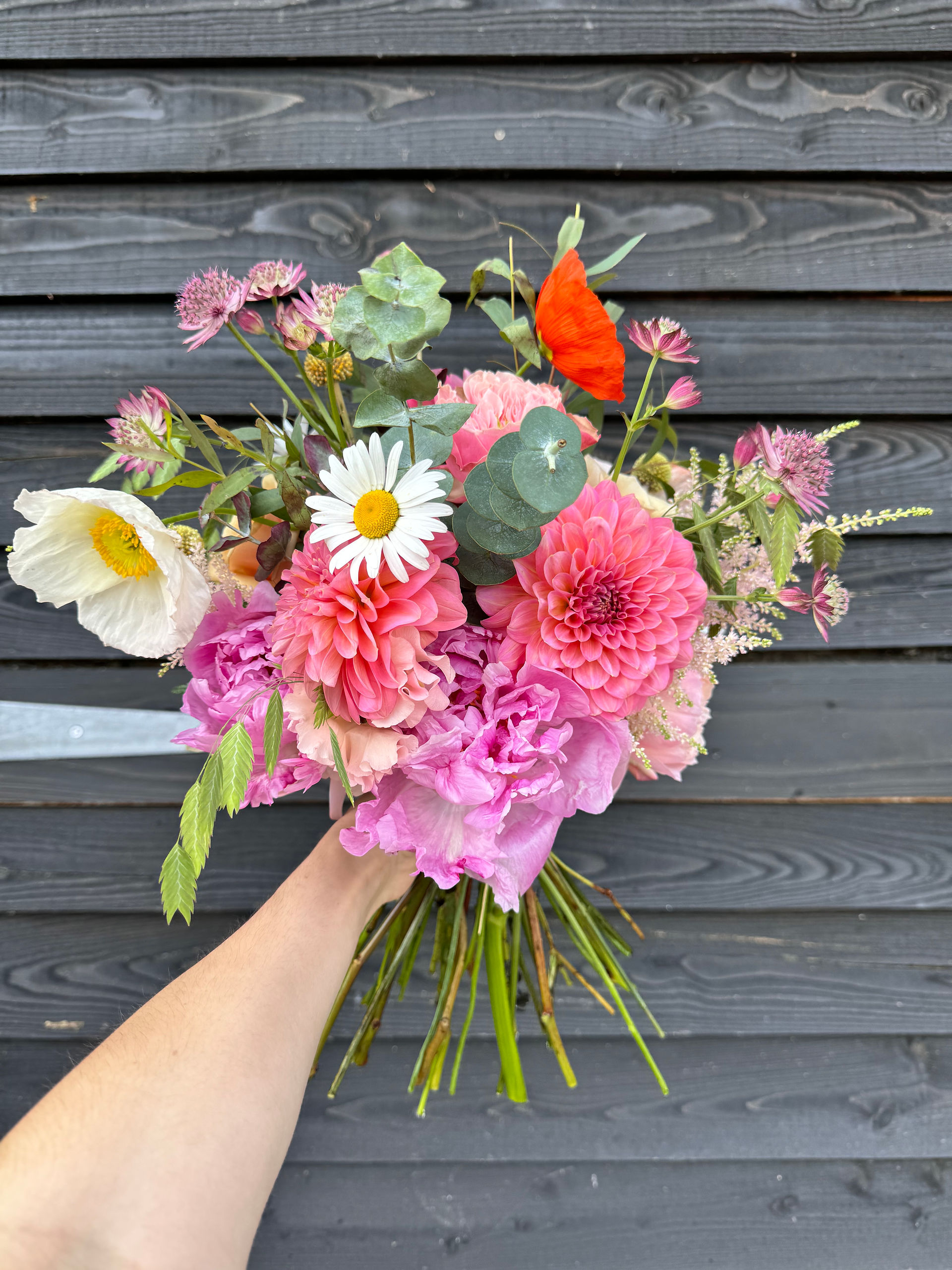 summer bouquet filled with bright seasonal flowers