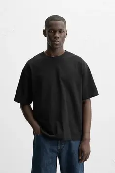 Front Closeup of Pushing Twenty Fashion Basic T-Shirt in black, with model in light background.