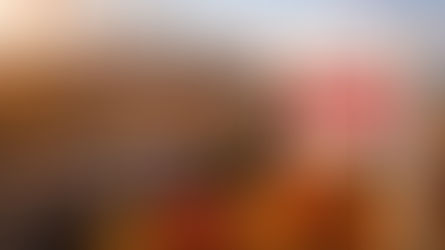 Chicago skyline at sunset overlooking brick apartment buildings with autumn trees and a rental property sign in the foreground, representing peak leasing season and rental demand in Chicago.