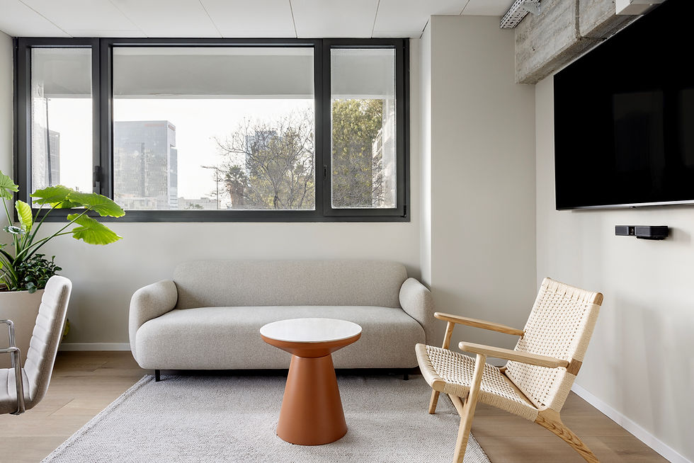 Eye-level view of a collaborative workspace with modern furniture and natural elements