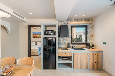 Modern kitchen with stone and wood elements.