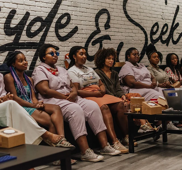 Group of Black women sitting and listening