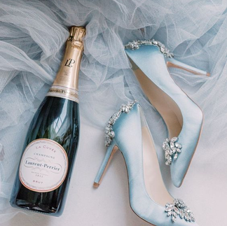 Blue wedding shoes and champagne