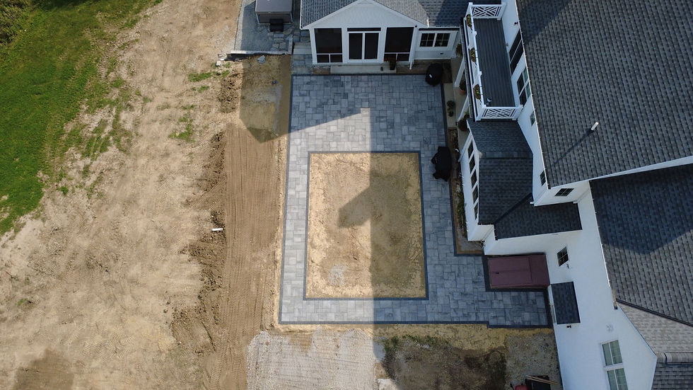 Residential property grading designed to improve stormwater drainage and reduce standing water in Northeast Ohio.