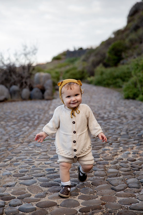 cheerful-cute-little-girl-walking-along-