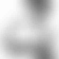 woman playing sound bowl with a peaceful expression