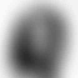 A woman holding her hair with shy demeanor