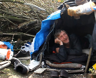 caring hands homeless man living in a tent in the woods_2x.jpg