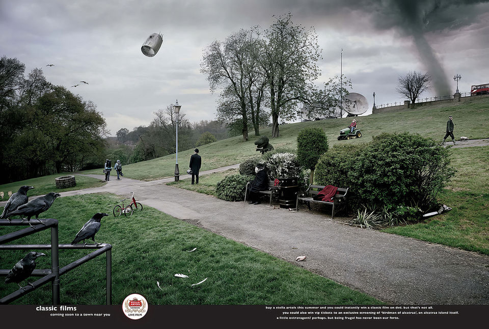 A retouched advertising image of a park in the UK filled with references to famous movies, such as the vehicles, people and signs, which all represent recognisable elements from each movie.