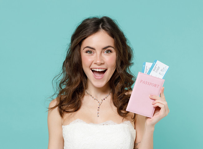 Excited bride young woman 20s years old in beautiful white wedding dress hold passport tic