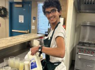 Nikhil pouring milk.jpg
