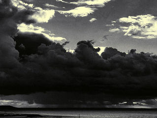 Black cloud crushing the beach.