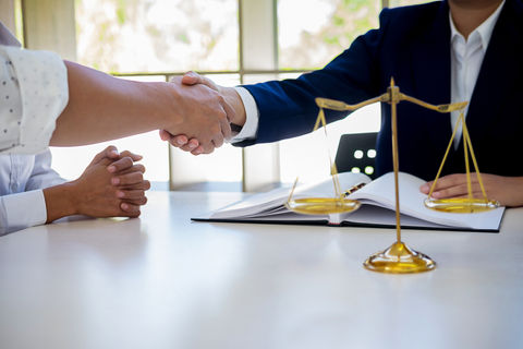 judge-gavel-with-justice-lawyers-having-team-meeting-law-firm-background (1).jpg