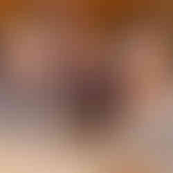 Gemini said Three smiling women posing together at a formally set dinner table during the 17th Annual Symphony of Food event at Bella Sera.