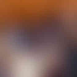  Gemini said A woman in a black dress stands and claps excitedly at her dinner table, celebrating with fellow guests during the 17th Annual Symphony of Food at Bella Sera.