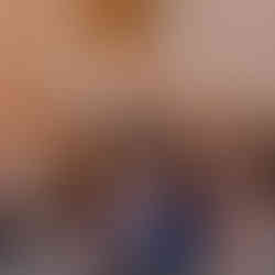  Gemini said A woman in a leaf-patterned dress smiles excitedly while holding up an auction paddle among a crowd of seated guests during the live auction portion of the 17th Annual Symphony of Food.