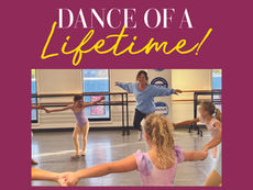 Adrianne Arena-Jacobs, the instructor, smiling as she teaches a group of young ballet students in a dance studio. The children, wearing leotards, are holding hands in a circle.