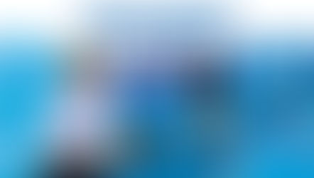 Feature image with the headline "THE BLUEPRINT TO WINNING MORE POINTS AS THE SERVING TEAM." The photo depicts a smiling pickleball player wearing a white cowboy hat in the foreground, with another player hitting a ball in the background against a blue "LevelUp Pickleball Camps" banner.