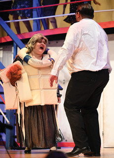 A man and woman share the spotlight in "Anything Goes," bringing humor and charm to the stage in this classic musical comedy.