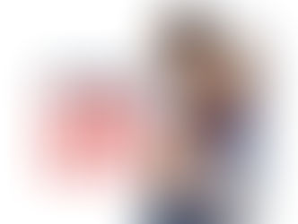 An action shot of Maya Bhandari in a red and black wrestling singlet and headgear, engaged in a competitive match. She is being held from behind by an opponent in a blue singlet as they both grapple for position on a grey wrestling mat. To the left, the stylized article title "Going to the MAT" is overlaid in bold blue and red text.