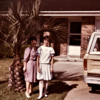 The author and her aunt posing in front of their house in the spring of 1983 during her first year in the United States.