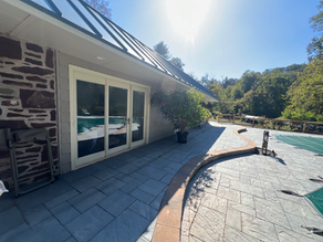 The after photo of the completed walkway in front of the pool house.