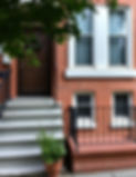 stairs to brick home