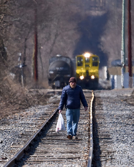 North Shore Railroad train in Bloomsburg, Pa.,approaches a trespassing pedestrian, Operation Lifesaver