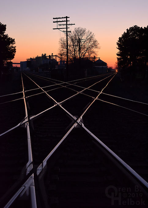 Sunset, Iron Triangle, Fostoria, Ohio, NS and CSX diamonds, eastbound CSX freight train, Oren B. Helbok photo