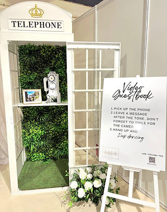 Vintage Telephone Booth featuring Video Guestbook, Emerald Oasis flower wall and instructions easel.