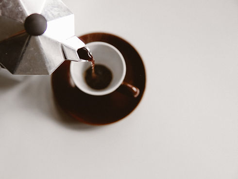 Espresso pouring into a cup