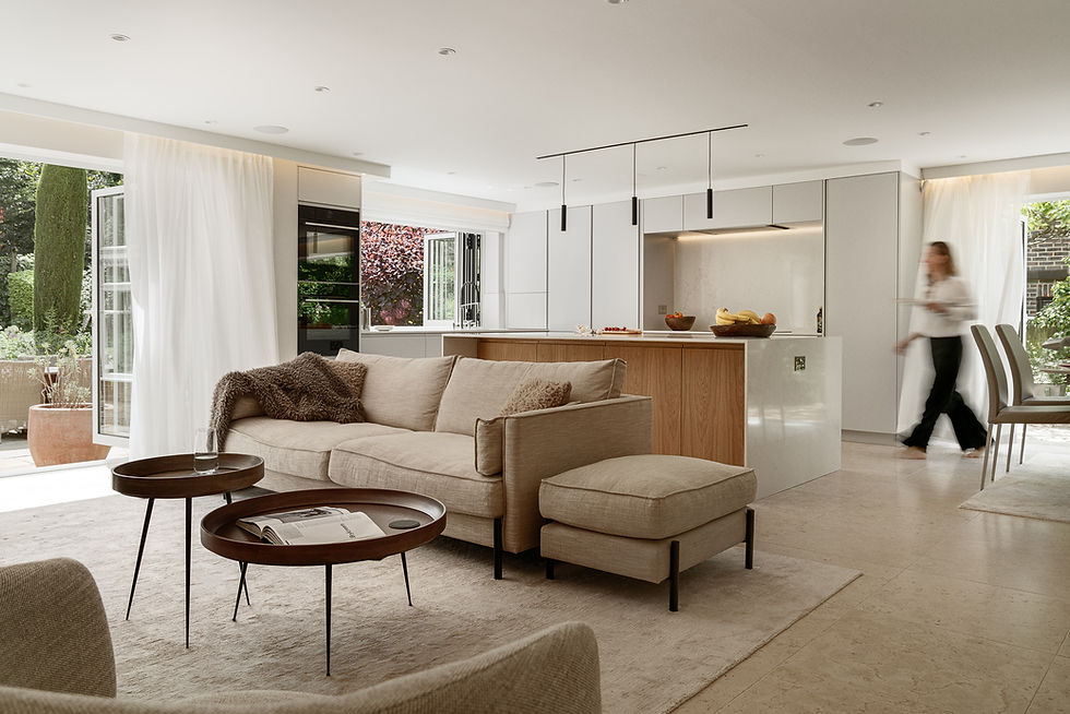 Eye-level view of a modern kitchen island with oak wrapping and quartz top