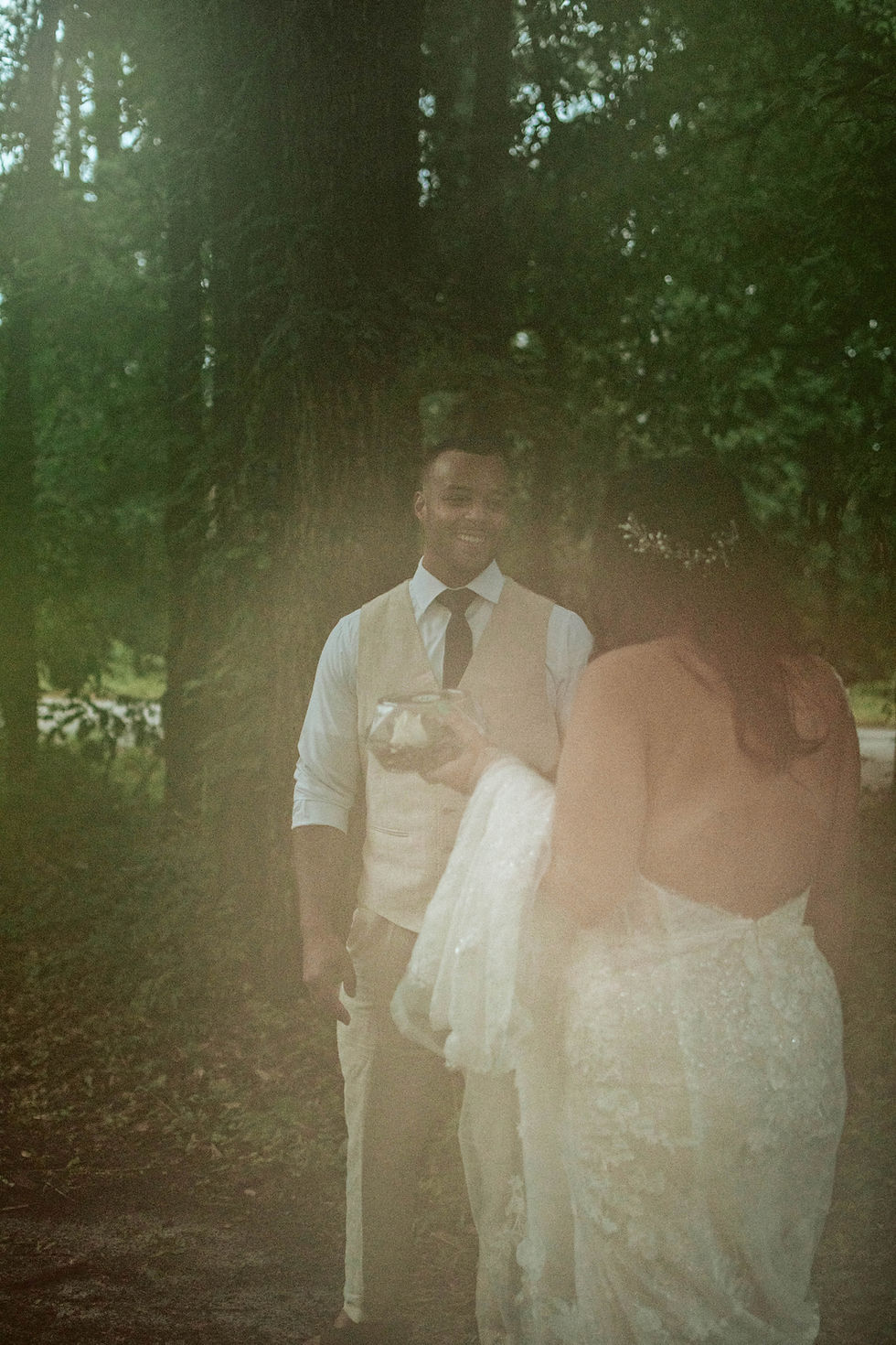 Hazy film photography for first look with bride and groom on elopement day.