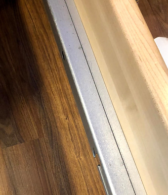 photo of pilates reformer rail, showing a black line as not being cleaned.
