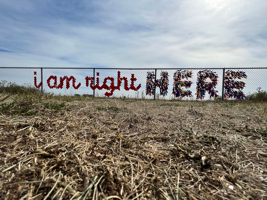 Fabric of Community - Ribbons spelling out "I am right HERE"