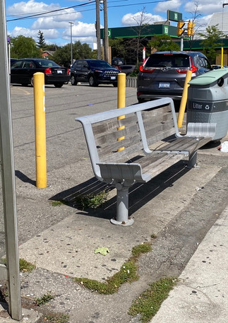 empty bench near traffic.jpeg