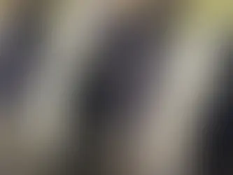 Door ding on the side of a black car.