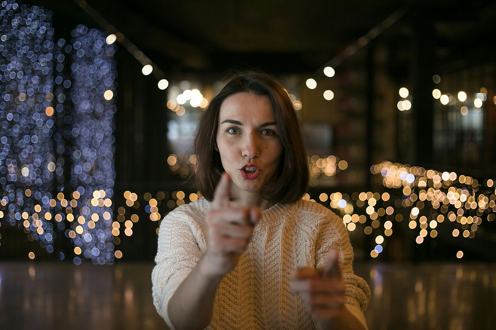 https://unsplash.com/photos/a-woman-making-a-funny-face-with-her-finger-NmdOsXaeV8Q