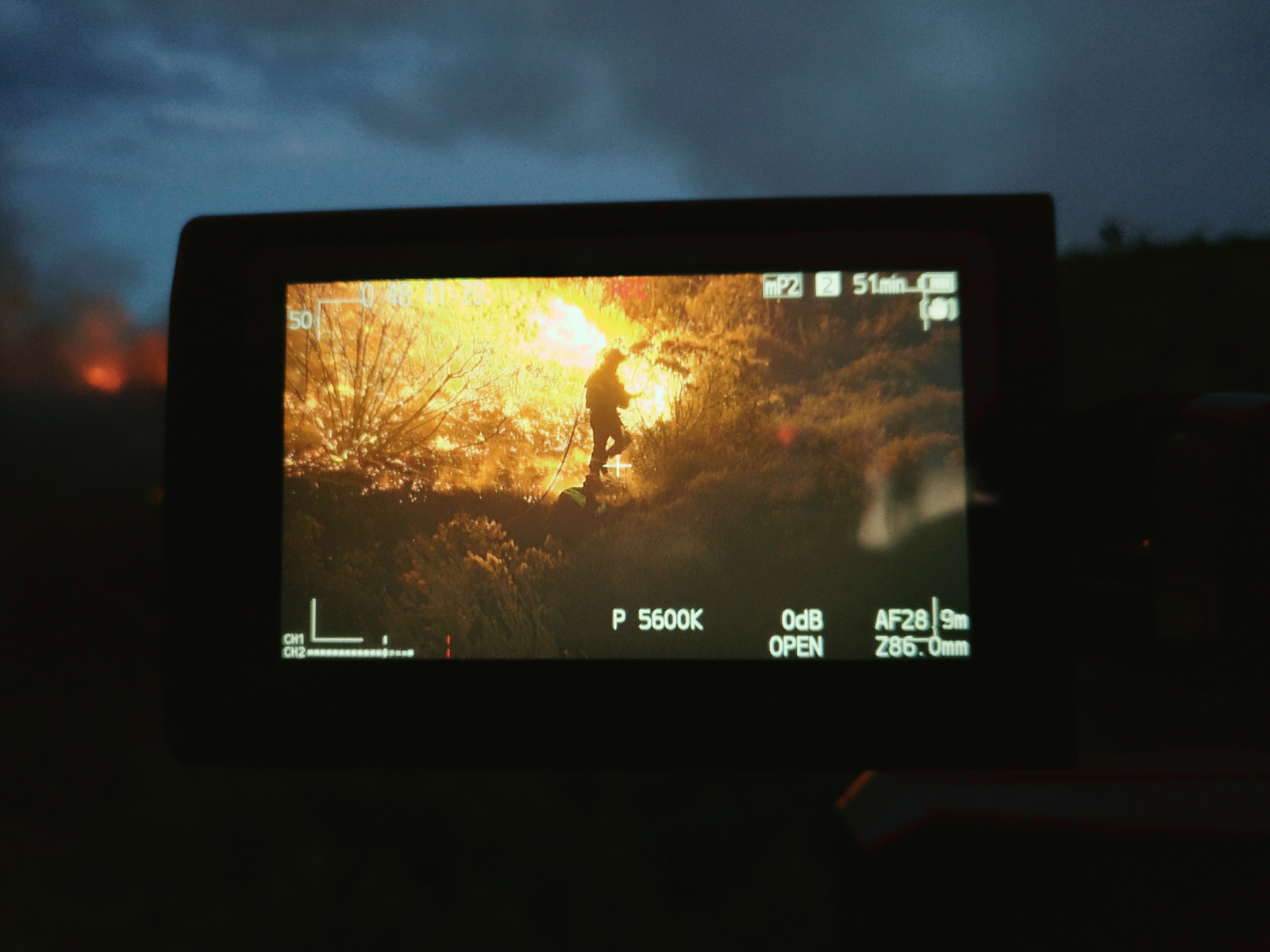 Firefighter battling with flames 