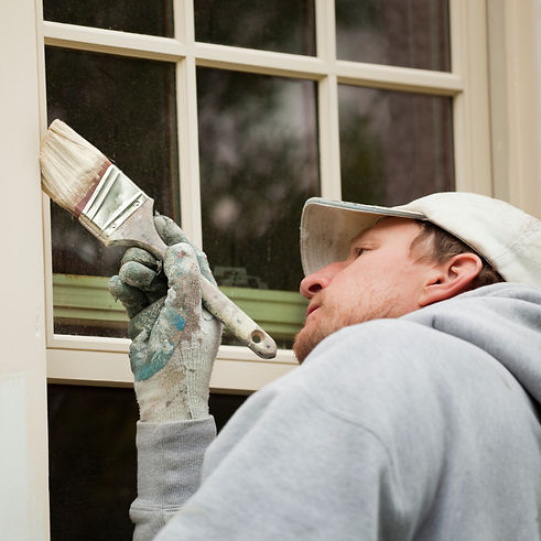 Handyman Direct painter painting a house exterior in Broome County, NY