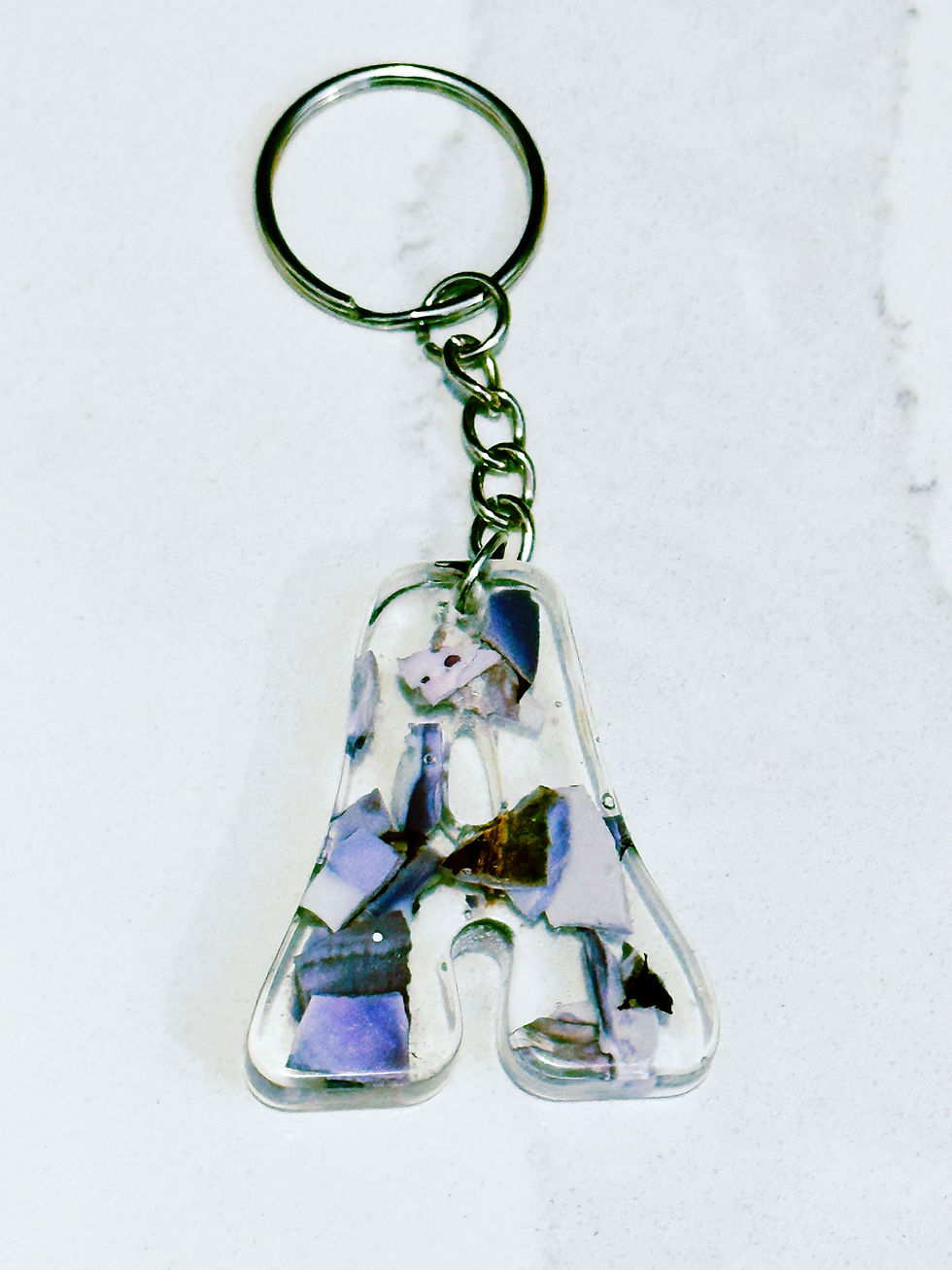 Thumbnail: Broken purple clam shells in letter A resin keychain