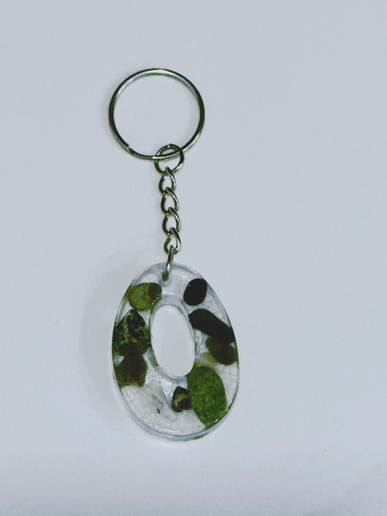 Thumbnail: Letter O epoxy resin keychain infused with real beach pebbles collected from the Pacific Shoreline beaches of Vancouver Islan