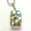 Thumbnail: Beachy Swearing Keychain with real seashells on aqua backdrop