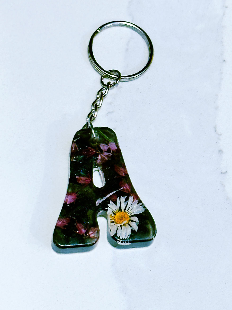 Daisy and heather flowers on back backdrop letter A resin keychain