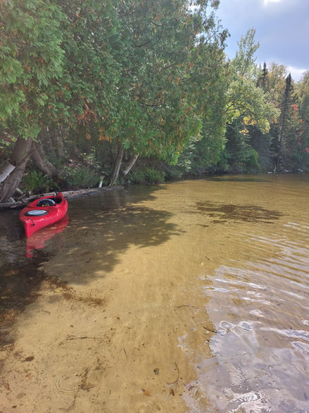 Kayak by the shoreline at a lake