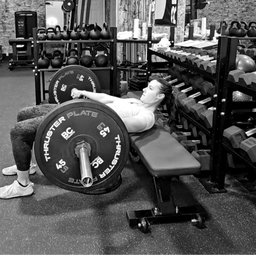 Laura lifting weights demonstrating proper form in strength training session