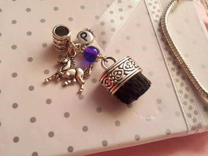 Thumbnail: Dandy brush charm
