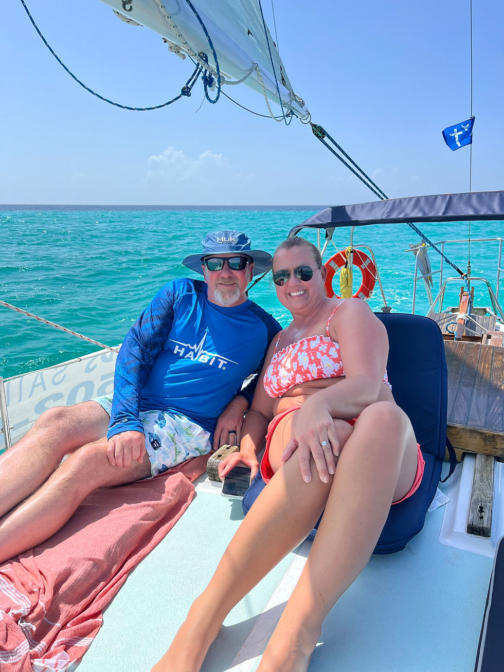 Relaxing on the deck during a private sailing cruise.