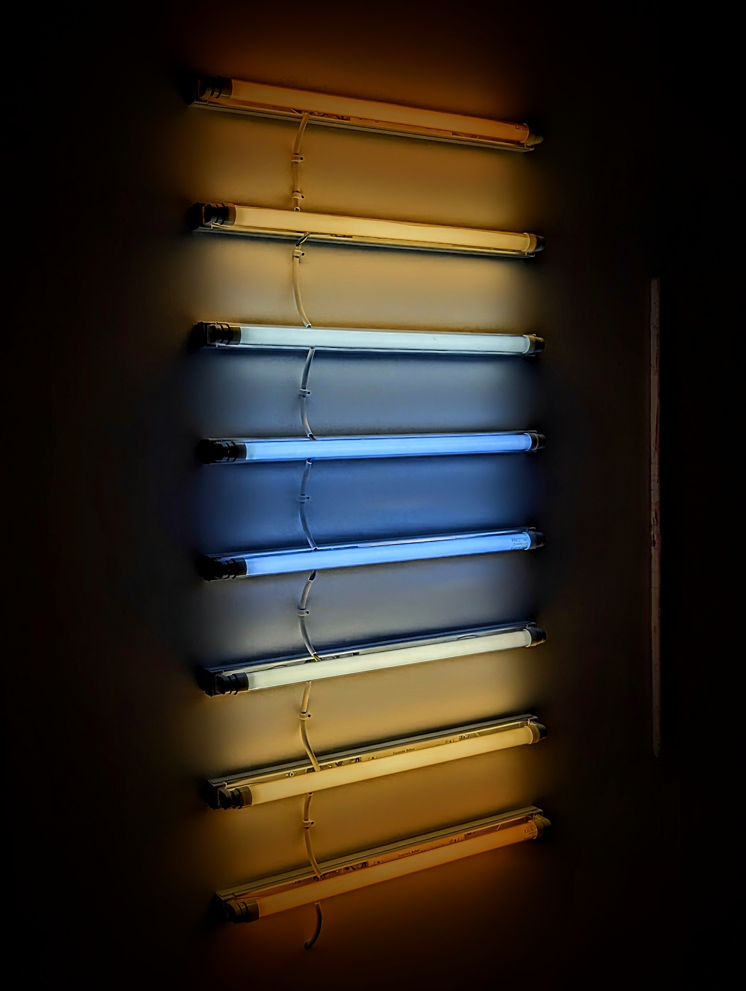 A fluorescent light installation of colours matching to the sky at sunset