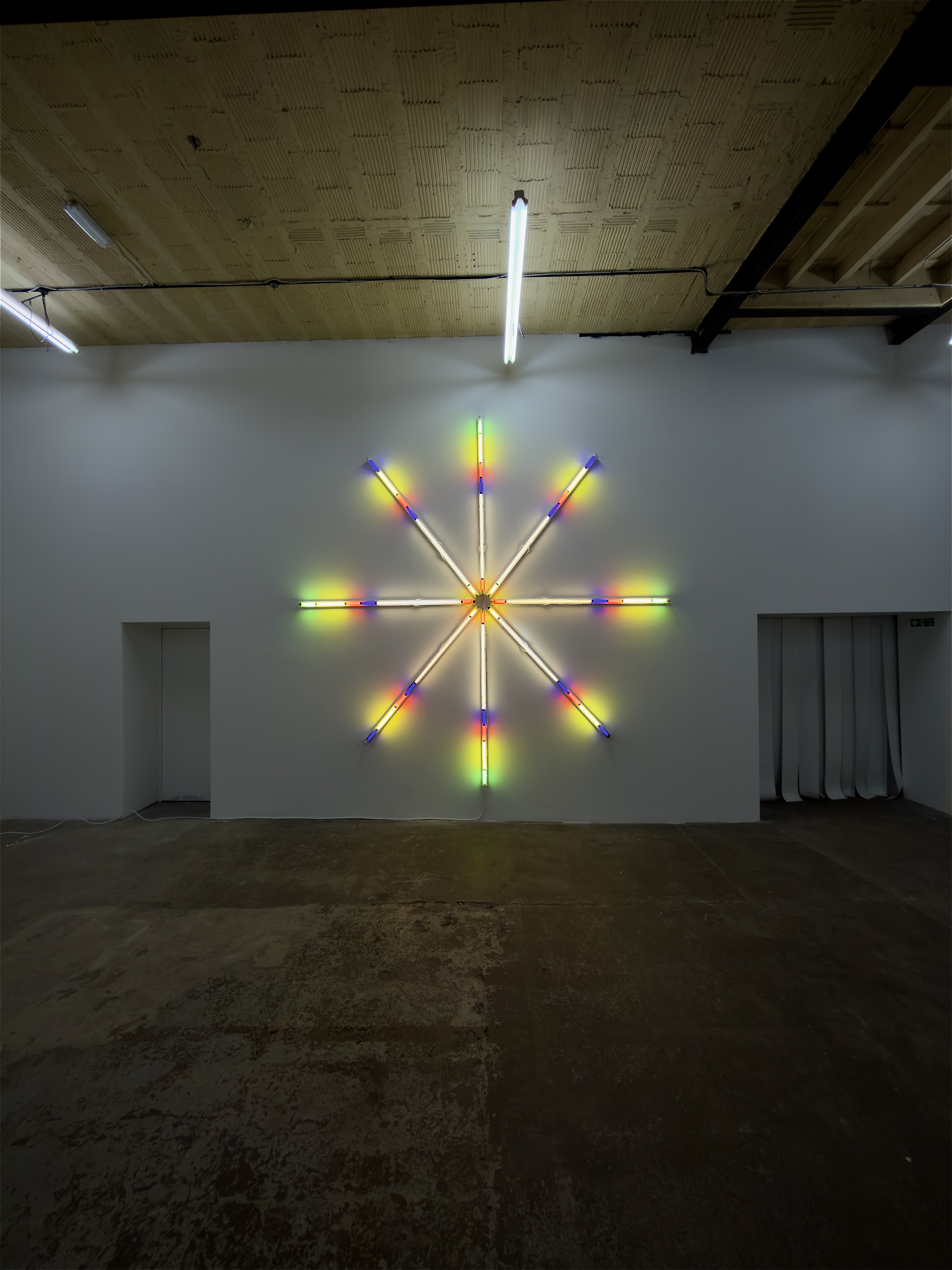 Rose Window IV (2026) illuminated in the gallery at Two Queens, Leicester.